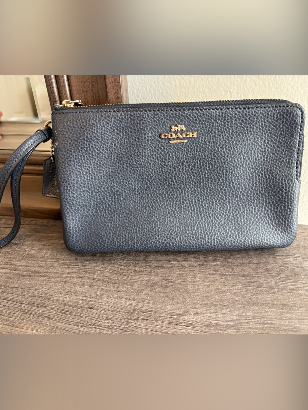 Coach Navy Pebbled Leather Wristlet with Gold Logo